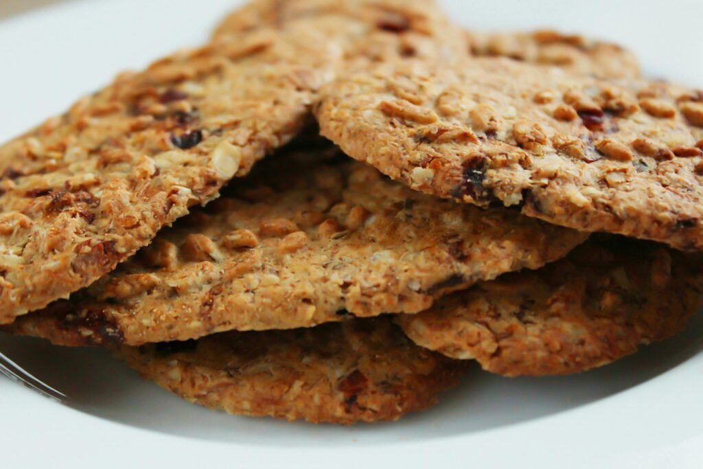 Close-up of homemade oatmeal cookies with raisins, a healthy treat.